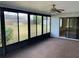 Sunroom with ceiling fan and sliding glass doors at 11556 Linden Dr, Spring Hill, FL 34608