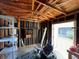 Workshop with shelving, workbench and riding mower at 11556 Linden Dr, Spring Hill, FL 34608