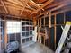 Workshop with shelving, workbench and riding mower at 11556 Linden Dr, Spring Hill, FL 34608