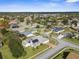 Aerial perspective of a house featuring a solar panel system and a screened pool enclosure at 14101 Andrew Scott Rd, Spring Hill, FL 34609