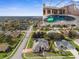 Aerial view showing home's exterior, pool, and surrounding neighborhood at 14101 Andrew Scott Rd, Spring Hill, FL 34609