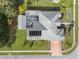 Overhead view of a single-Gathering home with a solar panel system, pool, and landscaped yard at 14101 Andrew Scott Rd, Spring Hill, FL 34609