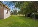 Spacious backyard with a large grassy area and privacy at 14101 Andrew Scott Rd, Spring Hill, FL 34609