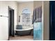 Bathroom with freestanding bathtub and shower at 14101 Andrew Scott Rd, Spring Hill, FL 34609