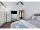 Bedroom with large window, dresser, and ensuite bathroom at 14101 Andrew Scott Rd, Spring Hill, FL 34609