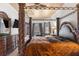Main bedroom with large four poster bed and ensuite at 14101 Andrew Scott Rd, Spring Hill, FL 34609