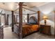 Main bedroom with large four poster bed and ensuite at 14101 Andrew Scott Rd, Spring Hill, FL 34609