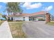 Community center with covered entryway and landscaping at 14101 Andrew Scott Rd, Spring Hill, FL 34609