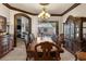Elegant dining room with a large table and pool view at 14101 Andrew Scott Rd, Spring Hill, FL 34609