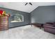 Spacious living room featuring tile floors and a large window at 14101 Andrew Scott Rd, Spring Hill, FL 34609