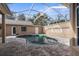 Screened-in pool area with a kidney shaped pool at 14101 Andrew Scott Rd, Spring Hill, FL 34609