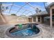 Relaxing kidney shaped pool with covered patio at 14101 Andrew Scott Rd, Spring Hill, FL 34609