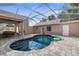 Screened pool and patio area with seating at 14101 Andrew Scott Rd, Spring Hill, FL 34609