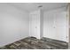 Bedroom with wood-look floors and neutral walls at 16076 Narrow St, Spring Hill, FL 34604