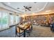 Inviting library with bookshelves, tables, and ample natural light at 1608 Morning Rose Pl, Trinity, FL 34655