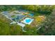 Aerial view of community pool, tennis and bocce courts at 19771 Tattnall Way, Brooksville, FL 34601