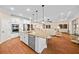 Modern kitchen featuring granite countertops, stainless steel appliances, and an island at 19771 Tattnall Way, Brooksville, FL 34601