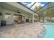 Spacious patio with dining area and access to the pool at 19771 Tattnall Way, Brooksville, FL 34601