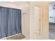 Bathroom with shower stall, linen closet, and a door to bedroom at 2509 Magellan Ave, Spring Hill, FL 34608