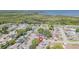 Aerial view showing home's location in a residential neighborhood near water at 3049 Moog Rd, Holiday, FL 34691