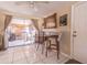 Small dining area with glass table and two bar stools at 3049 Moog Rd, Holiday, FL 34691