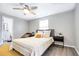 Bedroom with a queen bed, lots of natural light, and access to bathroom at 4209 Prince Pl # A, New Port Richey, FL 34652