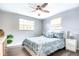 Spacious bedroom with ceiling fan and light gray walls at 4209 Prince Pl # A, New Port Richey, FL 34652