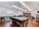 Community room features pool table, bookshelves, and ample seating at 4209 Prince Pl # A, New Port Richey, FL 34652