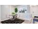 Small dining area with a round table and modern chairs at 4209 Prince Pl # A, New Port Richey, FL 34652