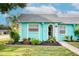 Quaint teal home with well-manicured landscaping at 4209 Prince Pl # A, New Port Richey, FL 34652