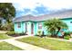 Cute teal home with a lush green lawn at 4209 Prince Pl # A, New Port Richey, FL 34652