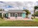 Quaint cottage with screened porch and patio, beautifully landscaped lawn at 4209 Prince Pl # A, New Port Richey, FL 34652