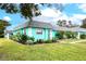 Charming teal home with a nicely landscaped yard at 4209 Prince Pl # A, New Port Richey, FL 34652