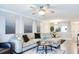 Living room with sectional sofa, and open concept to kitchen at 4209 Prince Pl # A, New Port Richey, FL 34652