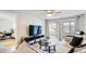 Bright living room with comfy seating and a view of the patio at 4209 Prince Pl # A, New Port Richey, FL 34652