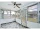 Cozy sunroom with ample natural light and patterned rug at 4209 Prince Pl # A, New Port Richey, FL 34652