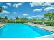 Refreshing community swimming pool with plenty of lounge chairs at 4209 Prince Pl # A, New Port Richey, FL 34652