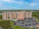 Aerial view of a large building complex with parking and a pool at 4516 Seagull Dr # 413, New Port Richey, FL 34652