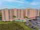 Aerial view of a building with pool, parking and landscaping at 4516 Seagull Dr # 413, New Port Richey, FL 34652