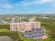 Aerial view of a large building complex with parking and a pool at 4516 Seagull Dr # 413, New Port Richey, FL 34652