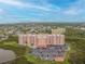 Aerial view of a large building complex with parking and a pool at 4516 Seagull Dr # 413, New Port Richey, FL 34652