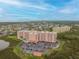 Aerial view of a large building complex with parking and a pool at 4516 Seagull Dr # 413, New Port Richey, FL 34652