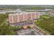 Aerial view of a large building with parking and waterfront at 4516 Seagull Dr # 413, New Port Richey, FL 34652