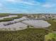 Aerial view of waterfront community with boat docks and lush landscaping at 4516 Seagull Dr # 413, New Port Richey, FL 34652