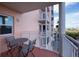 Relaxing balcony with patio furniture and partial building view at 4516 Seagull Dr # 413, New Port Richey, FL 34652