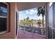 Private balcony offering scenic views of palm trees and parking at 4516 Seagull Dr # 413, New Port Richey, FL 34652