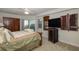 Spacious bedroom with a king-size bed, large TV, and balcony access at 4516 Seagull Dr # 413, New Port Richey, FL 34652