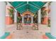Condo building entrance featuring benches and a tranquil fountain at 4516 Seagull Dr # 413, New Port Richey, FL 34652