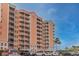 Condo building with parking and landscaping at 4516 Seagull Dr # 413, New Port Richey, FL 34652