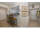 White kitchen with breakfast bar and view into living area at 4516 Seagull Dr # 413, New Port Richey, FL 34652